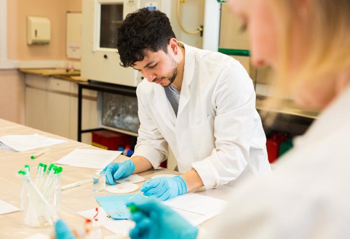 A forensics student working in a lab.