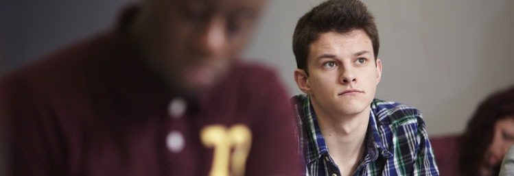 A student listening attentively in a lecture