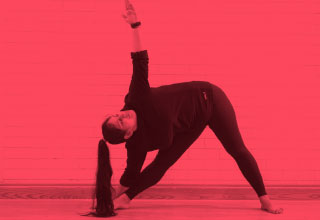 Woman doing stretch from toes to ceiling